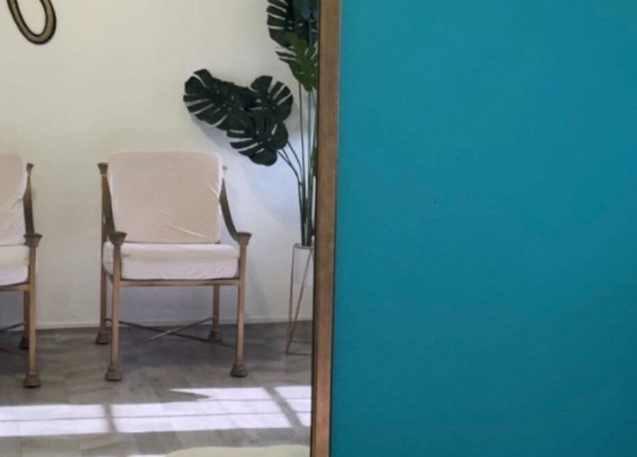 Stylish seating area at The Ikonic Glo, Prospect, Saint James, BB with vibrant decor and lush plant.