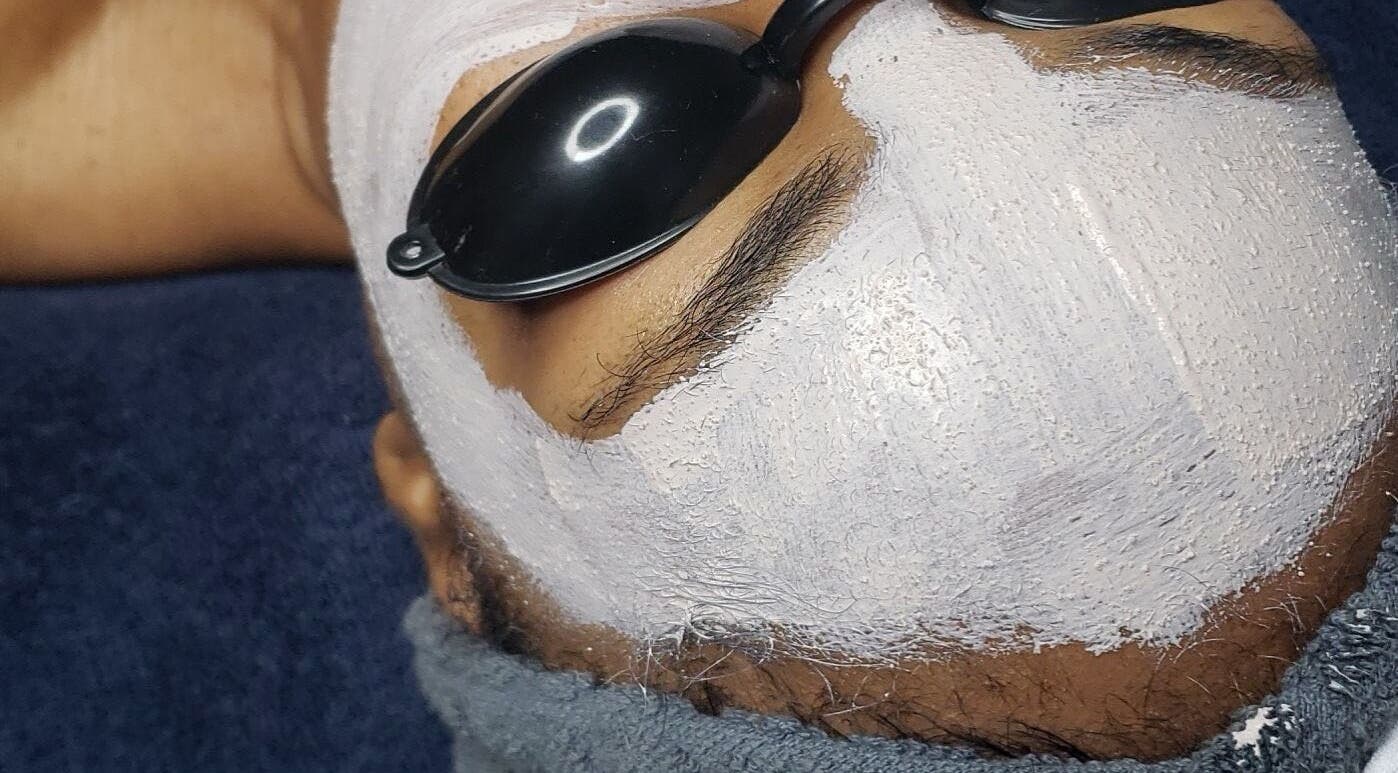 Facial treatment with white mask at The Ikonic Glo, Prospect, Saint James, BB, offering a serene spa experience.