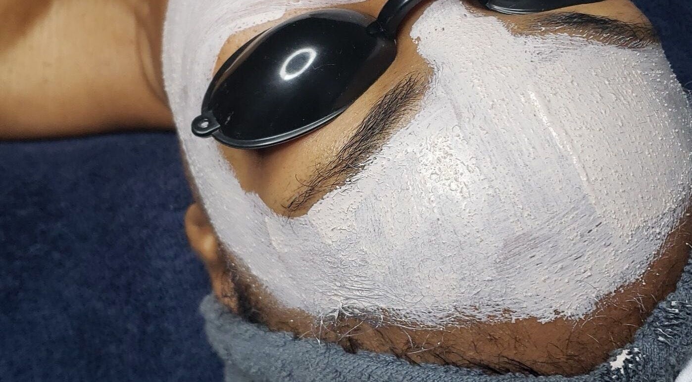 Facial treatment with white mask at The Ikonic Glo, Prospect, Saint James, BB, offering a serene spa experience.