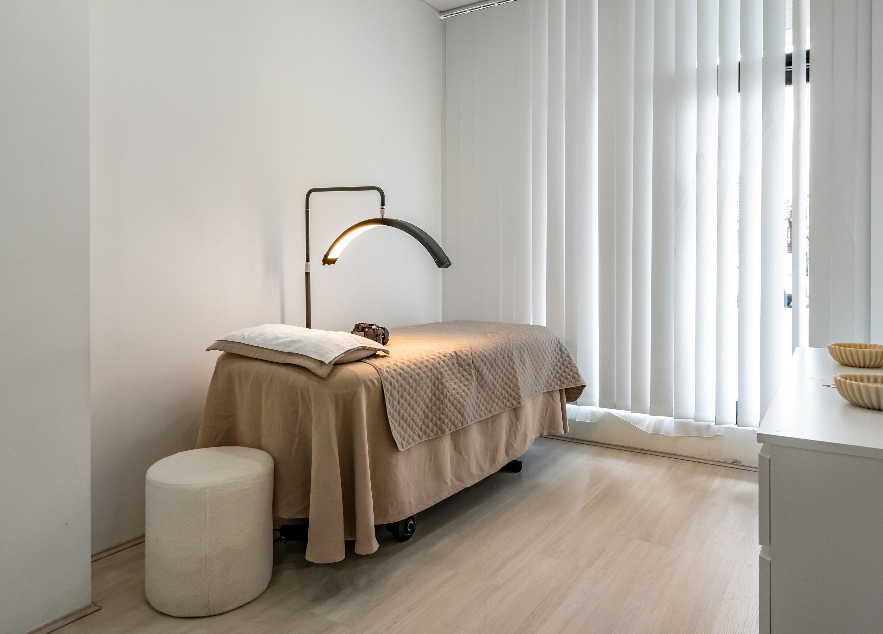 Tranquil treatment room at Luminous Skin by Amal, Rockdale, New South Wales, AU. Cozy bed and relaxing ambiance.