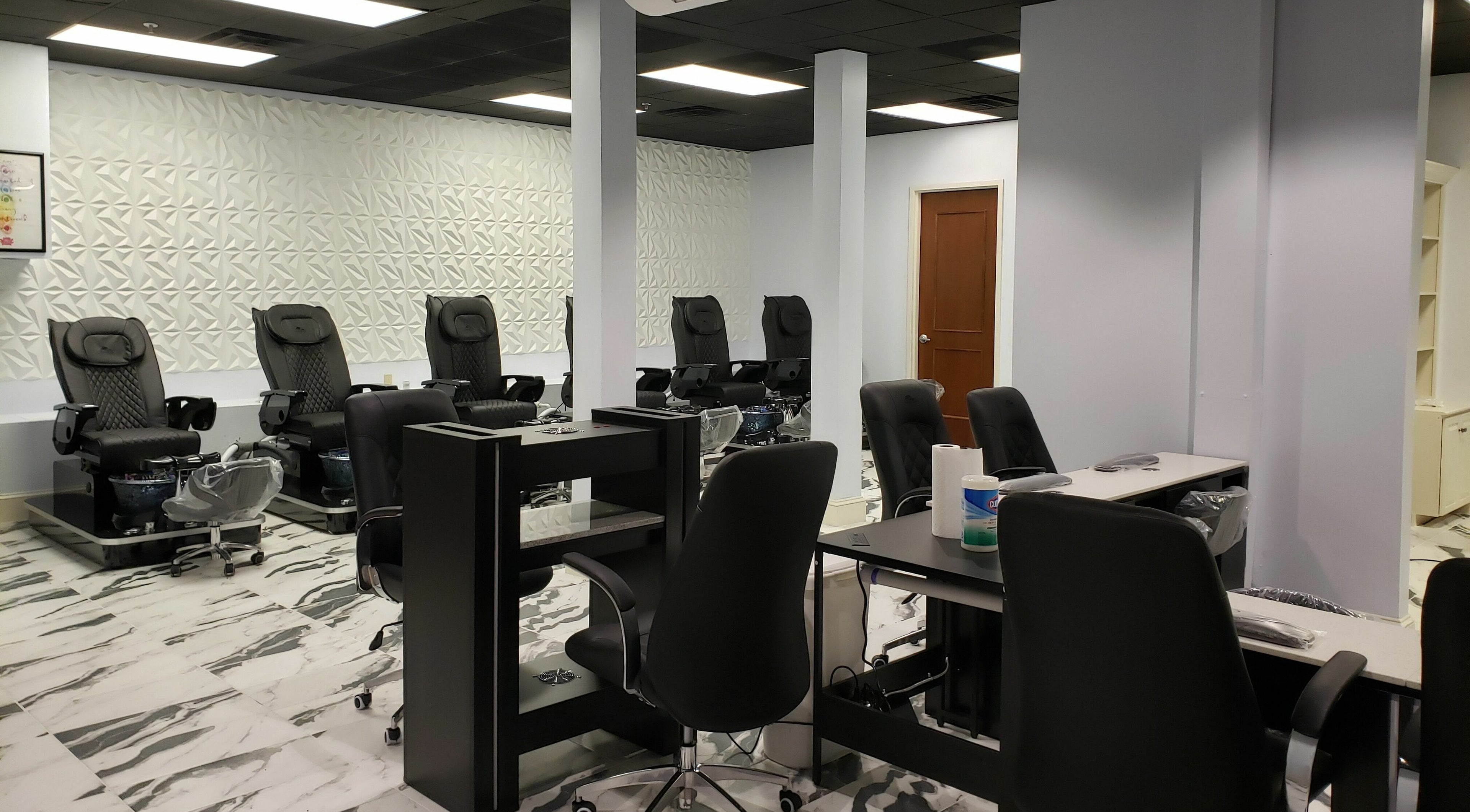 Reverie Nail Lounge features chic pedicure stations in Woodfin, North Carolina, US for a luxurious pampering experience.