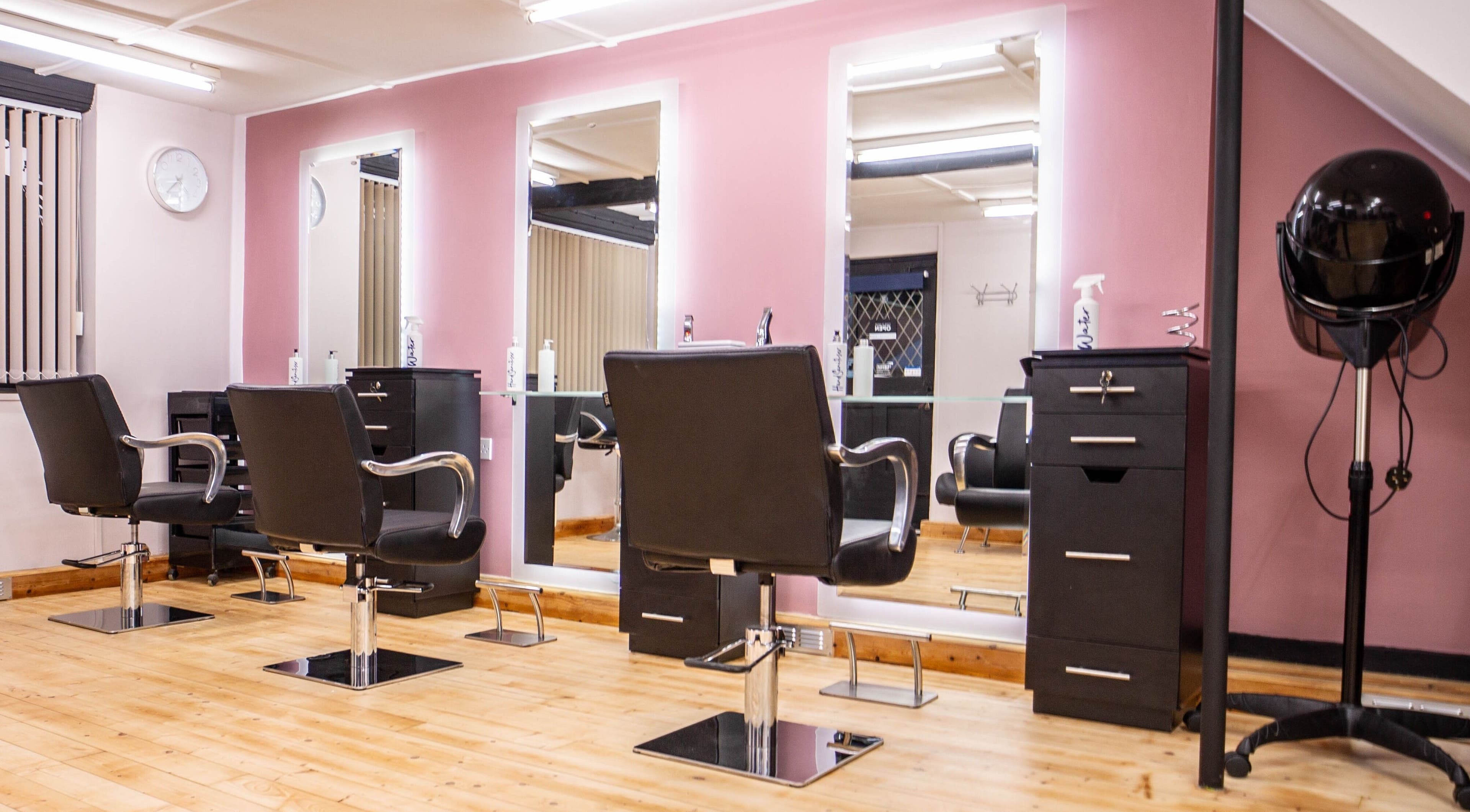 Modern styling chairs and mirrors at Sapphire Blu Hair and Beauty Limited, Norwich, England, GB.