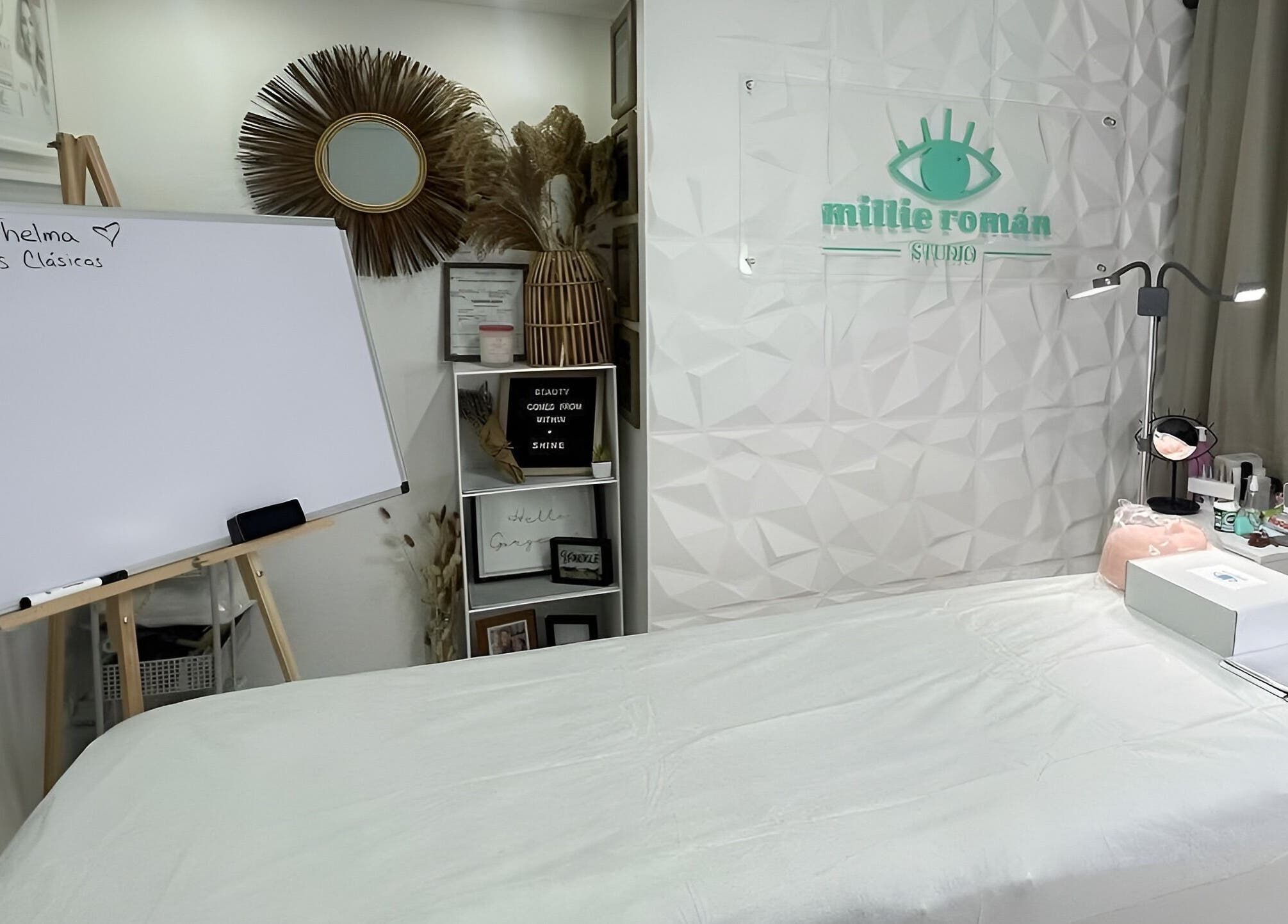 Elegant spa interior at Millie Román Studio, San Juan, San Juan, PR, featuring a cozy treatment bed and decor.