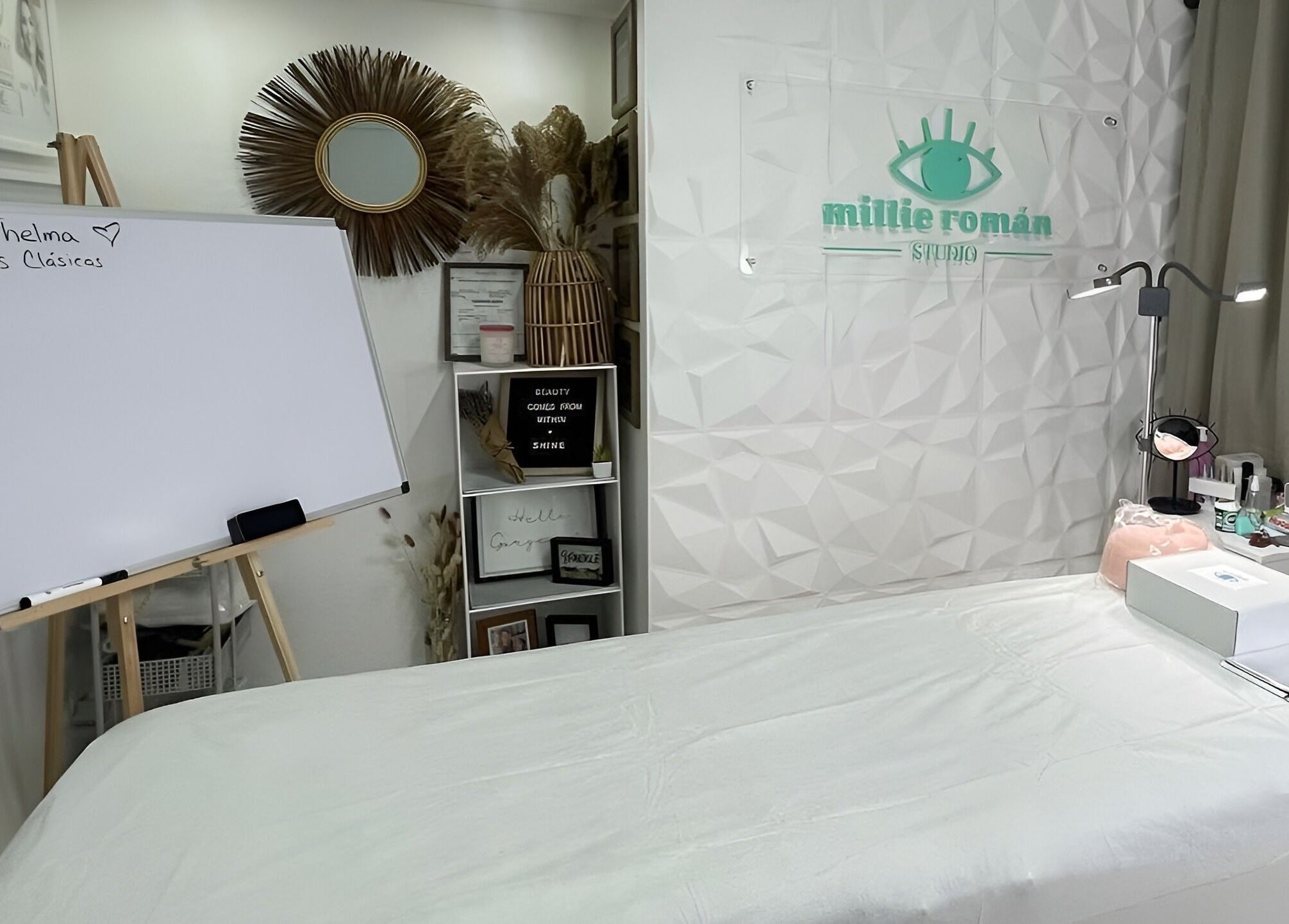 Elegant spa interior at Millie Román Studio, San Juan, San Juan, PR, featuring a cozy treatment bed and decor.