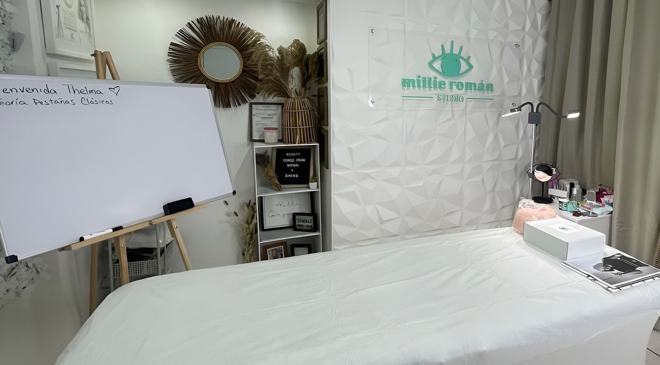 Elegant spa interior at Millie Román Studio, San Juan, San Juan, PR, featuring a cozy treatment bed and decor.