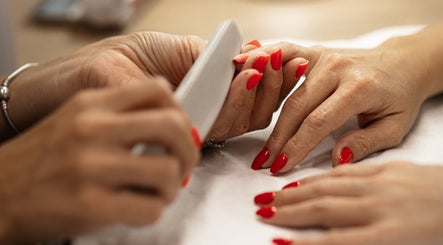 Professional manicure service at HelloWoman Hazelwood (Menlopark), Pretoria, Gauteng, ZA with red nail polish.