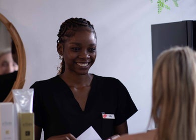 Smiling staff greeting customer at HelloWoman Hazelwood (Menlopark), Pretoria, Gauteng, ZA wellness center.
