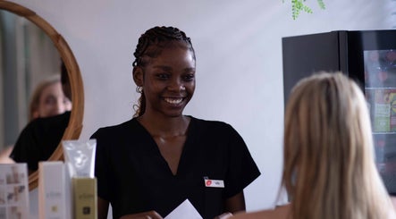 Smiling staff greeting customer at HelloWoman Hazelwood (Menlopark), Pretoria, Gauteng, ZA wellness center.