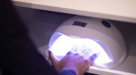 Hand under UV lamp for gel nails at HelloWoman Hazelwood (Menlopark), Pretoria, Gauteng, ZA.