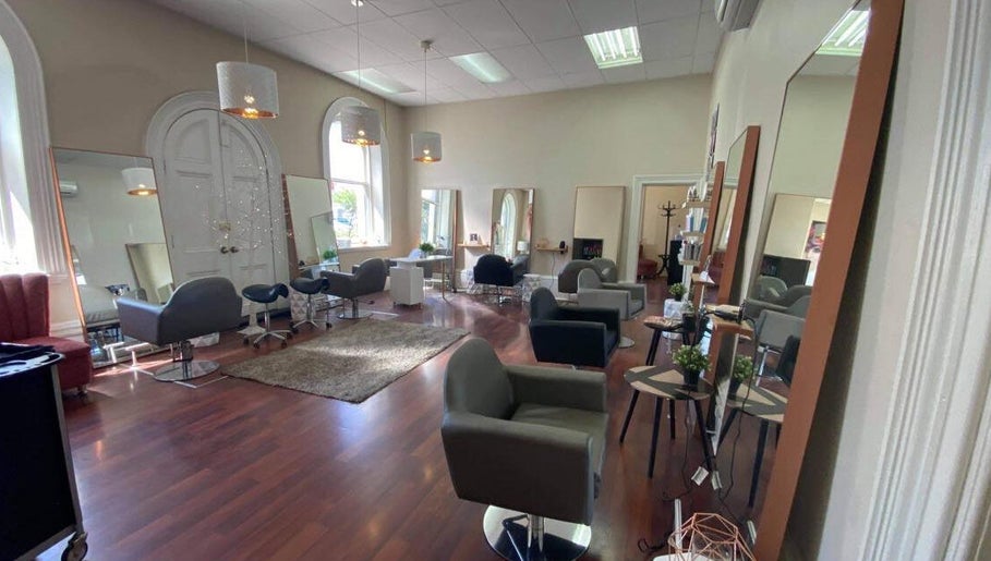 Spacious salon interior at Obsession Hair & Body, Gawler, South Australia, AU featuring modern styling chairs.