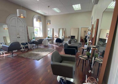 Spacious salon interior at Obsession Hair & Body, Gawler, South Australia, AU featuring modern styling chairs.
