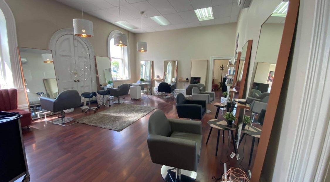 Spacious salon interior at Obsession Hair & Body, Gawler, South Australia, AU featuring modern styling chairs.