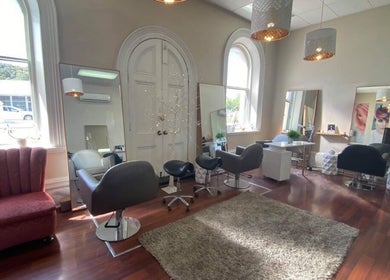 Cozy, modern interior of Obsession Hair & Body in Gawler, South Australia, AU with stylish seating and mirrors.