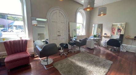 Cozy, modern interior of Obsession Hair & Body in Gawler, South Australia, AU with stylish seating and mirrors.