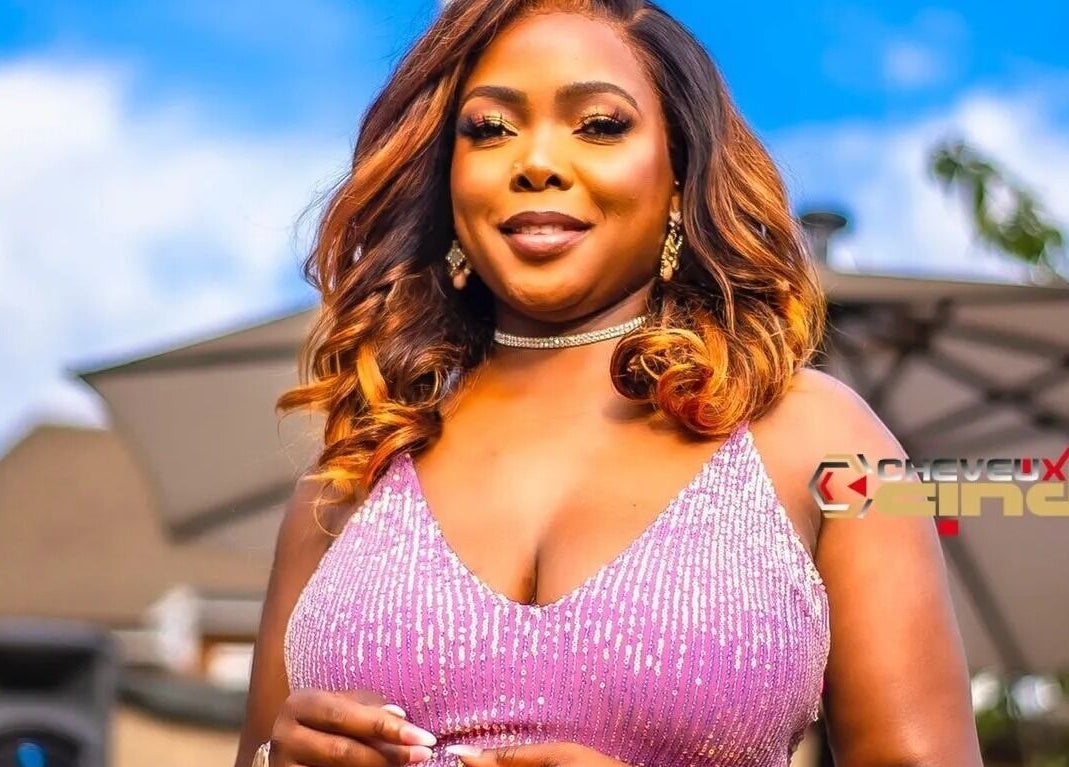 Elegant woman in pink dress at Cheveux By Cindy, Bexleyheath, England, GB, showcasing glamour and style.