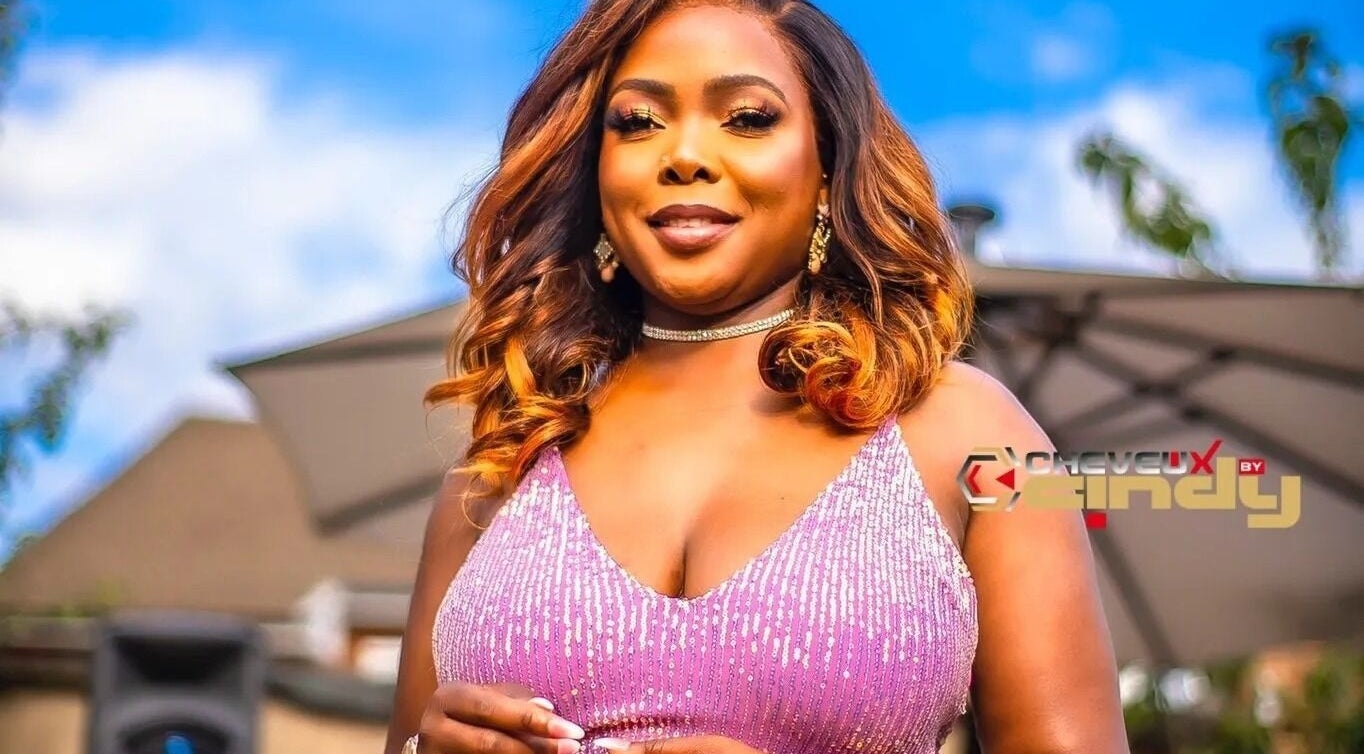 Elegant woman in pink dress at Cheveux By Cindy, Bexleyheath, England, GB, showcasing glamour and style.