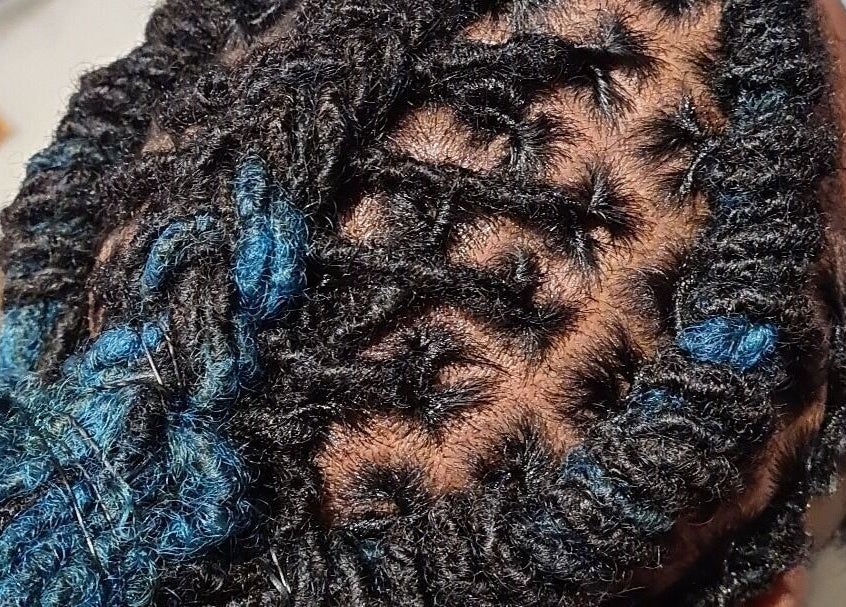 Detailed braiding style at Cheveux By Cindy, Bexleyheath, England, GB. Perfect for stylish, modern looks.