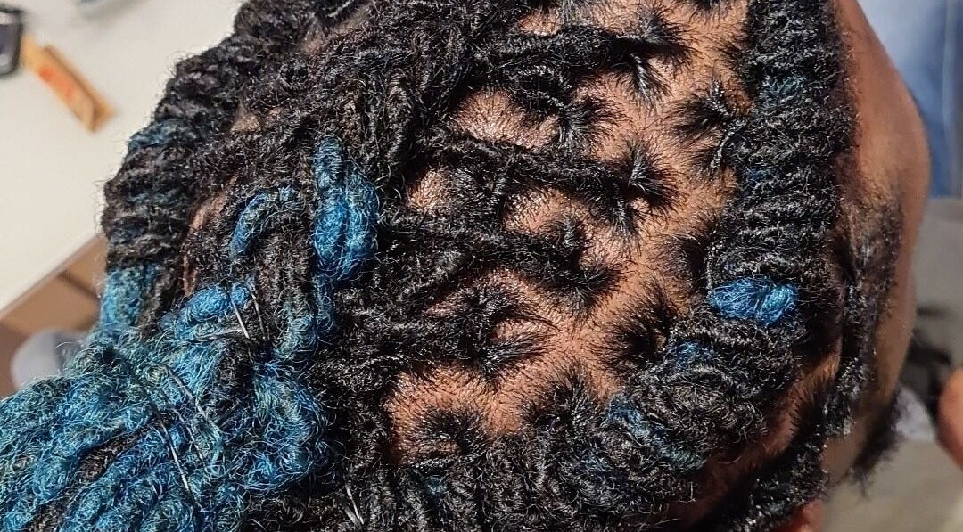 Detailed braiding style at Cheveux By Cindy, Bexleyheath, England, GB. Perfect for stylish, modern looks.