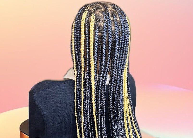 Stylish braids hairstyle at Cheveux By Cindy, Bexleyheath, England, GB. A perfect blend of creativity and skill.