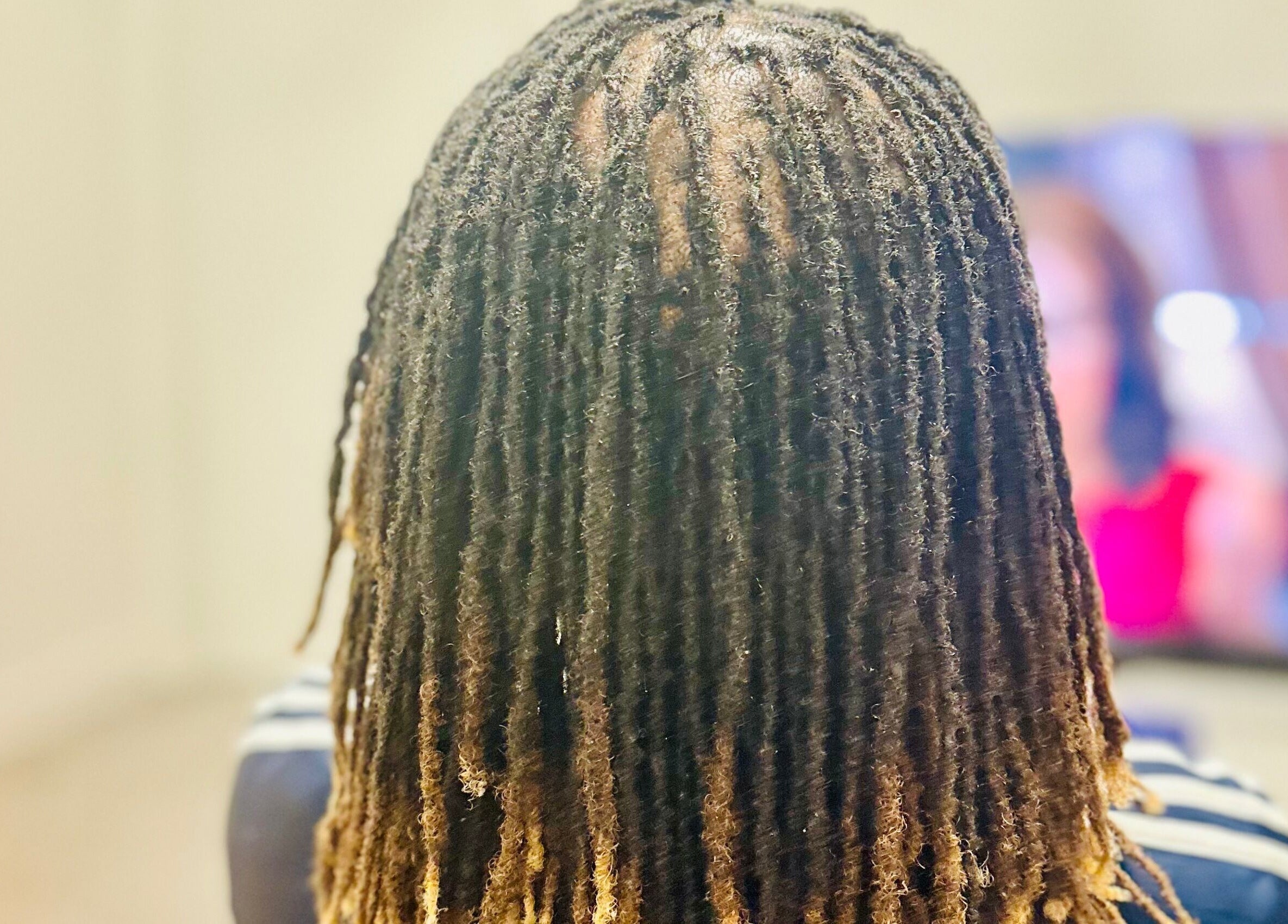 Stylish dreadlocks at Cheveux By Cindy, Bexleyheath, England, GB showcase intricate style and care.