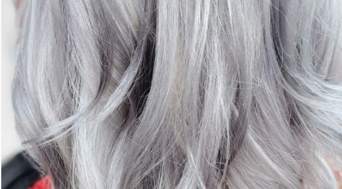Close-up of styled silver hair at Hairbyscot in Washington, Missouri, US showcasing vibrant, healthy texture.