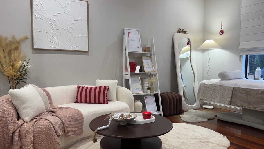 Elegant interior of Beauty By Sofia Katerina, Magill, South Australia, AU showcasing spa bed and comfy seating.