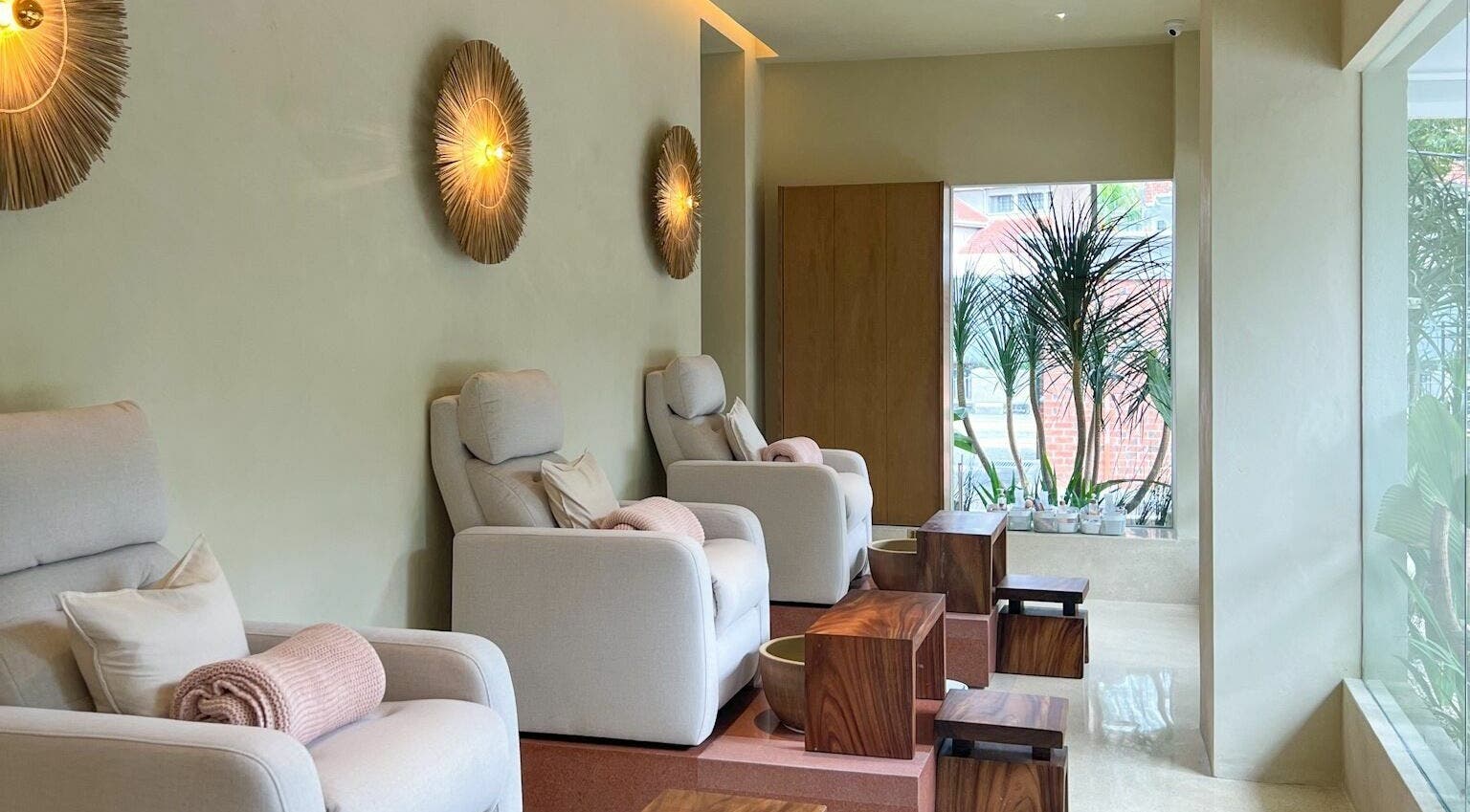 Relax in plush chairs at LYLA Beauty Lounge, Kuala Lumpur, Wilayah Persekutuan Kuala Lumpur, MY with lush decor.