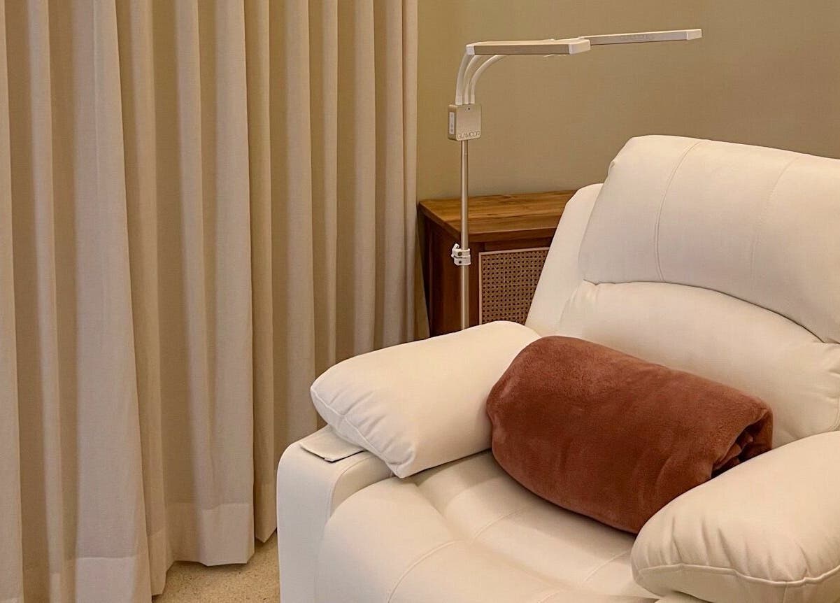 Comfortable white chair at LYLA Beauty Lounge, Kuala Lumpur, perfect for relaxation and wellness.