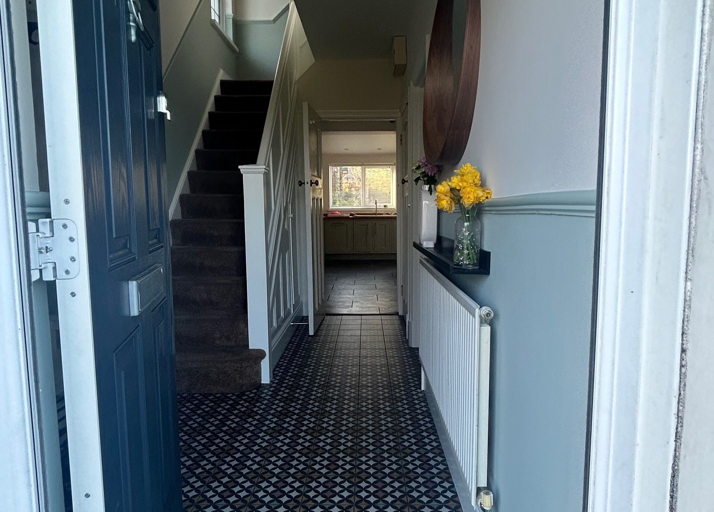 Cozy entry with tiled floor, leading to Glow Girl Club and Megan Tucker PMU, Morriston, Wales, GB.