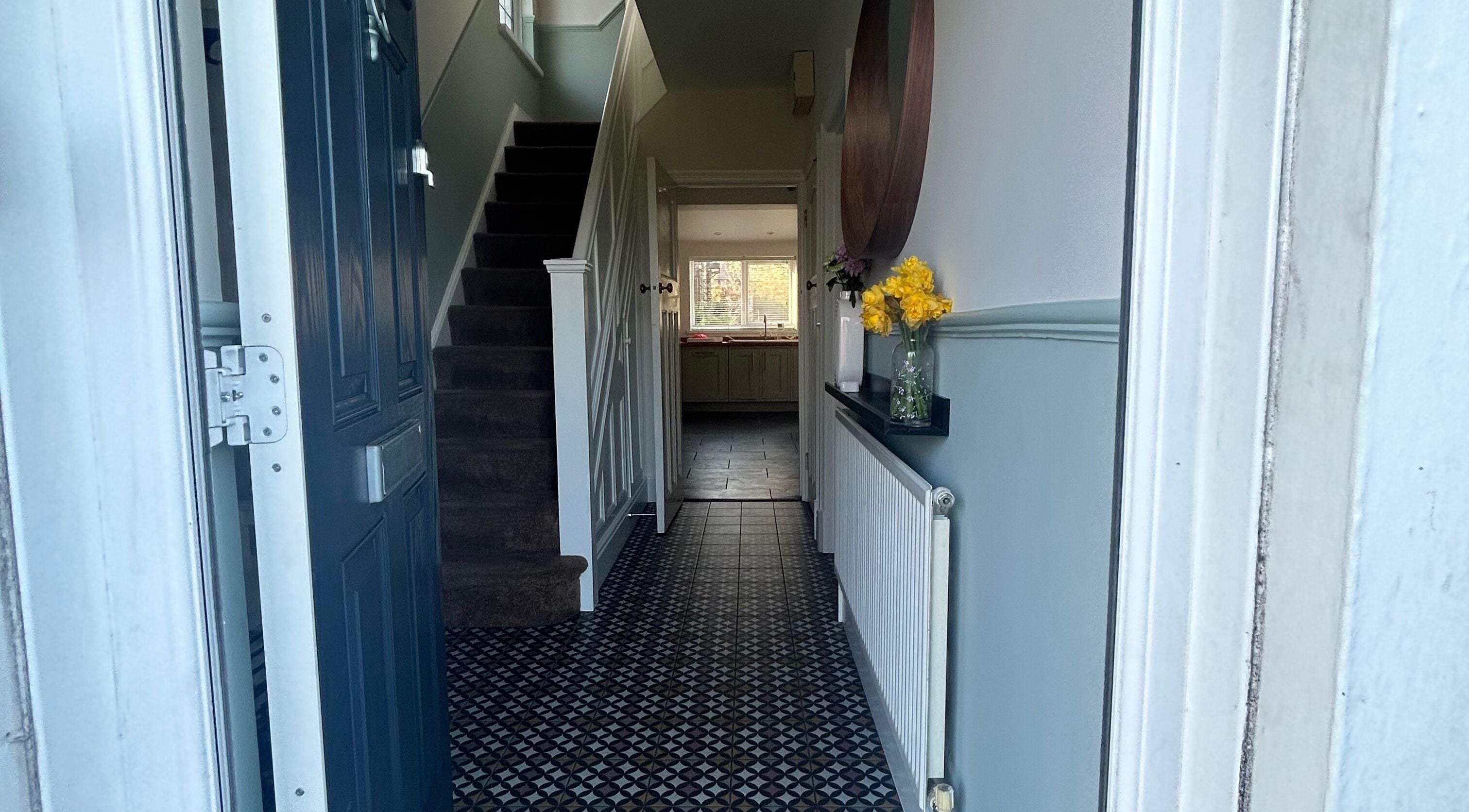 Cozy entry with tiled floor, leading to Glow Girl Club and Megan Tucker PMU, Morriston, Wales, GB.