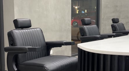 Modern black salon chairs at Studio P, Melbourne, Victoria, AU creating a sleek, stylish atmosphere.