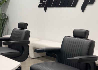 Elegant black salon chairs at Studio P, Melbourne, Victoria, AU offering a modern beauty experience.