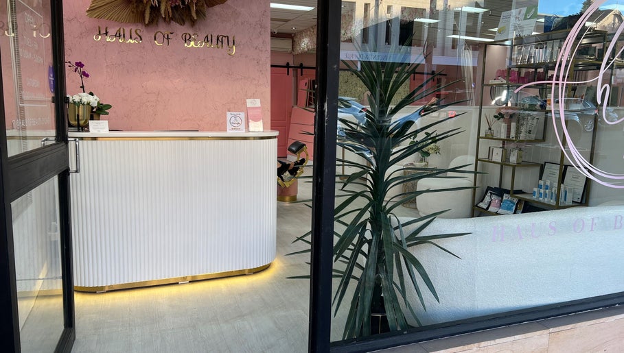 Entrance of Haus of Beauty in Waverley, NSW, showcasing elegant decor and reception desk.