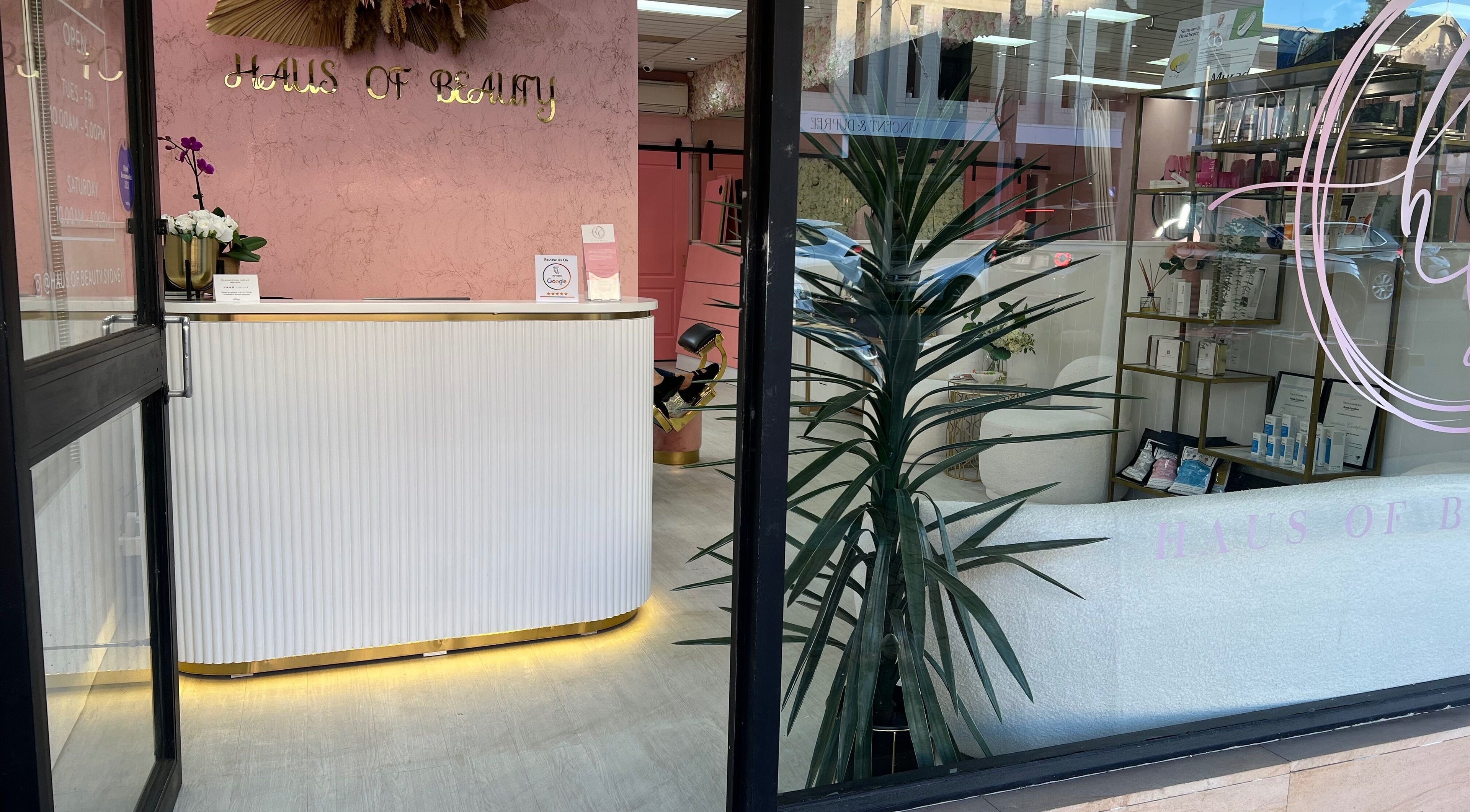 Entrance of Haus of Beauty in Waverley, NSW, showcasing elegant decor and reception desk.