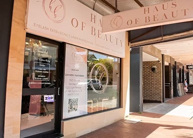 Entrance of Haus of Beauty in Waverley, NSW, AU, showcasing elegant signage and inviting storefront.
