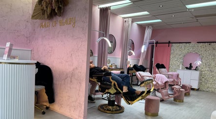 Elegant beauty salon interior at Haus of Beauty, Waverley, New South Wales, AU with pink decor and floral accents.