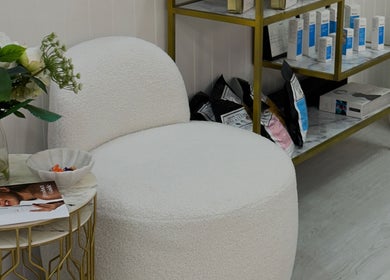 Elegant lounge area at Haus of Beauty, Waverley, New South Wales, AU featuring chic seating and decor.
