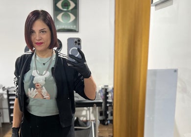 Viviana Sp Tattoo Artist at Melbourne, Victoria, AU in her studio, capturing a selfie.