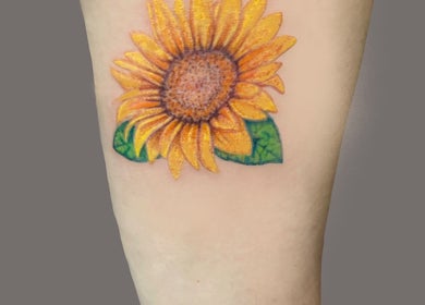 Vibrant sunflower tattoo by Viviana Sp Tattoo Artist in Melbourne, Victoria, AU on light skin.