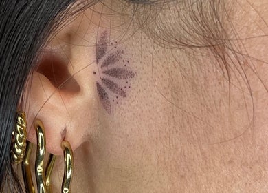 Delicate ear tattoo by Viviana Sp Tattoo Artist, located in Melbourne, Victoria, AU.