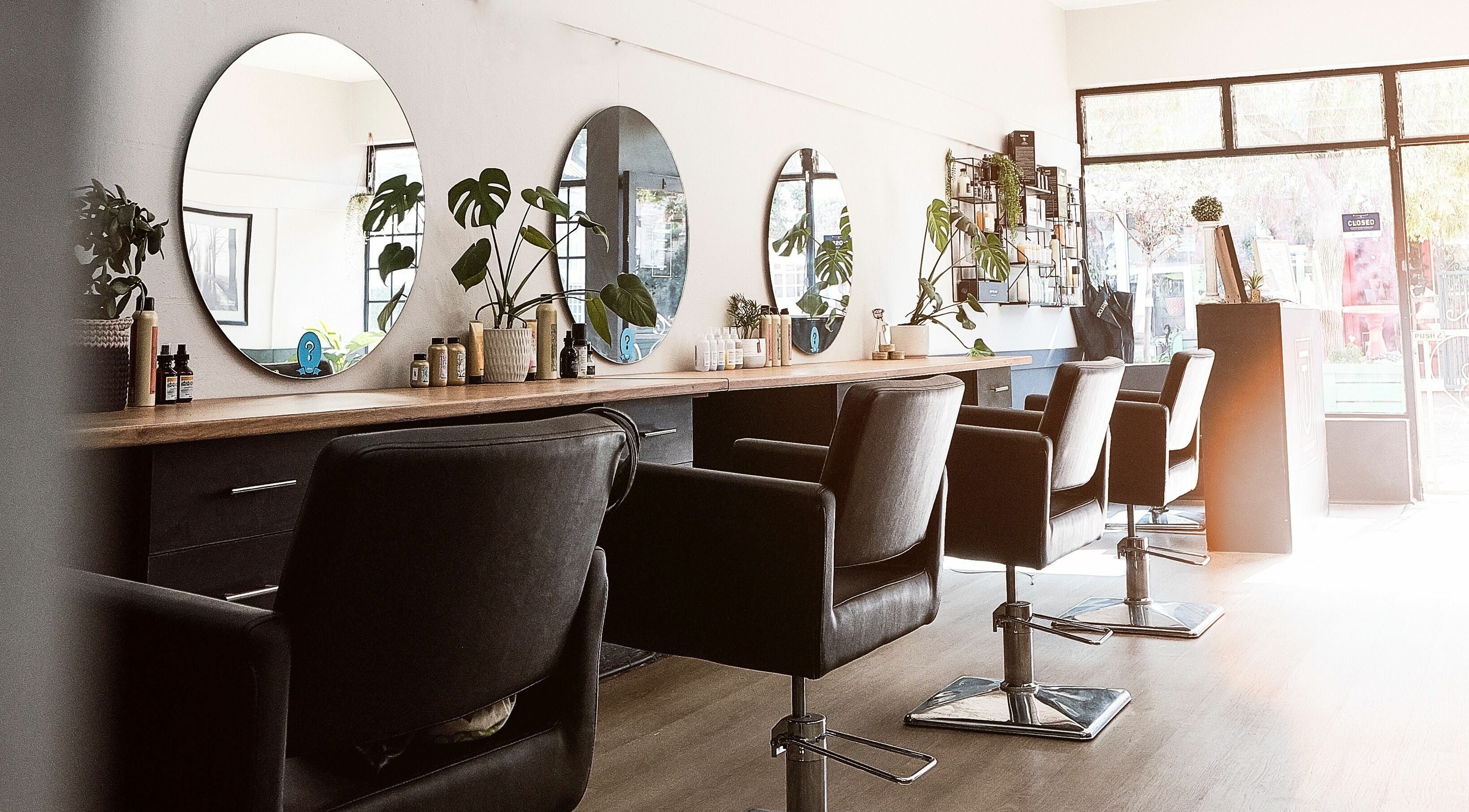 Modern, stylish interior of Jay Thomas Hairdressing Hermanus, inviting seating in Hermanus, Western Cape, ZA.