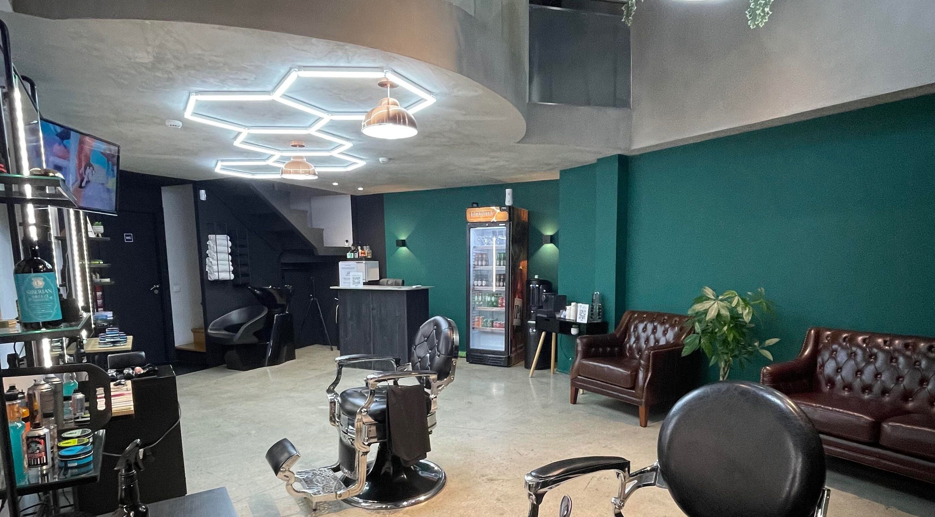 Interior of Augustus Barbershop in Lisboa, Lisboa, PT with modern chairs and retro decor.