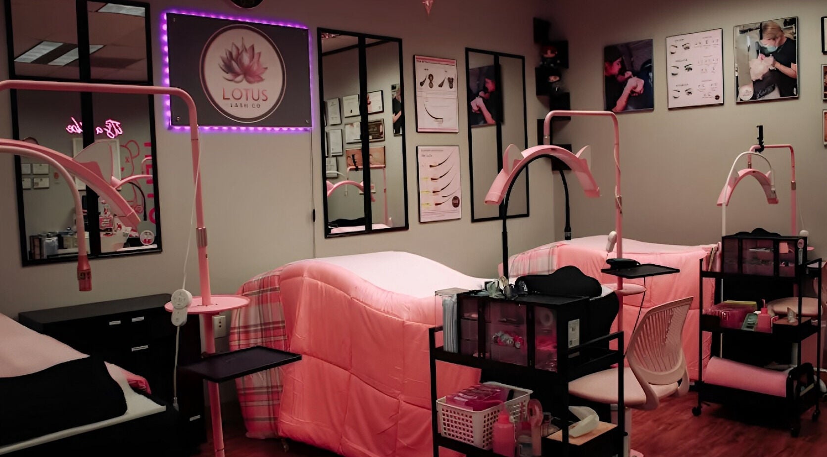 Cozy interior of Lotus Lash Co in Stafford, Texas, US featuring pink treatment beds and elegant decor.