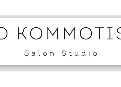Signage of O Kommotis Salon Studio, a beauty salon in London, England, GB.