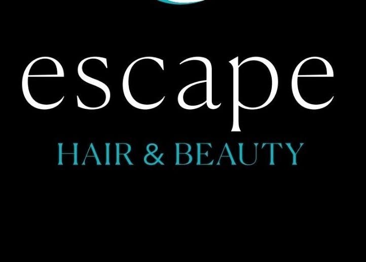 Elegant logo of Escape Hair & Beauty, located in London, England, GB, on a sleek black background.