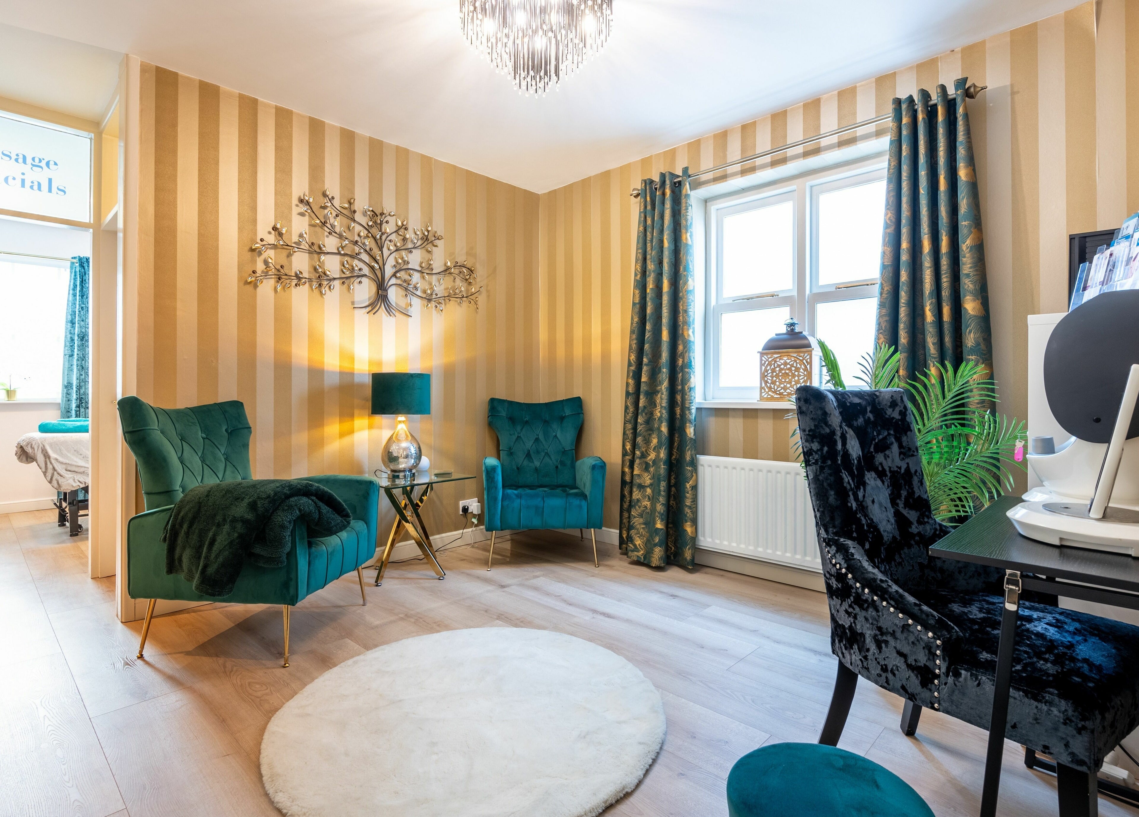 Luxurious spa room at Body Perfection, Willenhall, England, GB with plush chairs and calming decor.