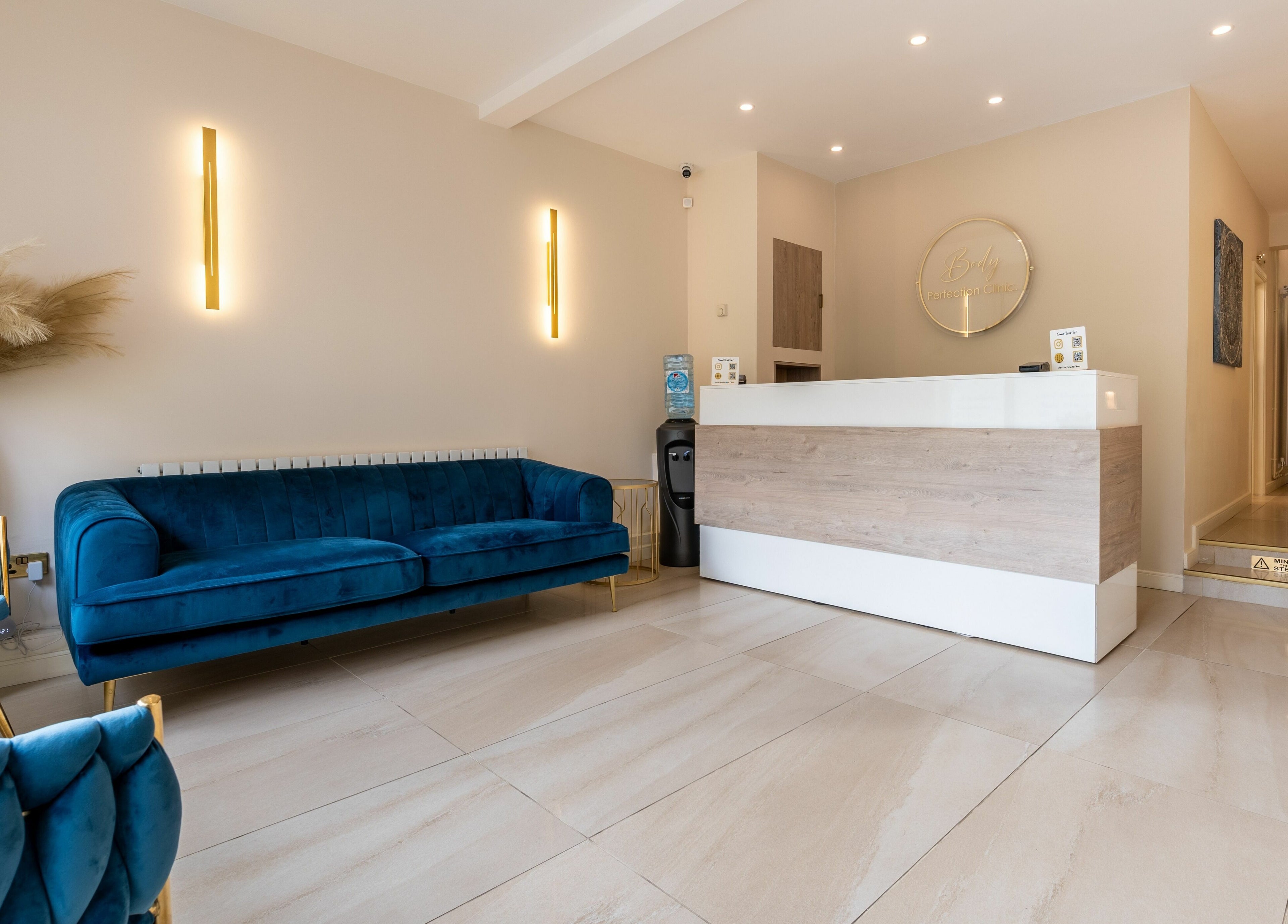 Body Perfection reception area in Willenhall, England, GB, featuring cozy seating and modern decor.