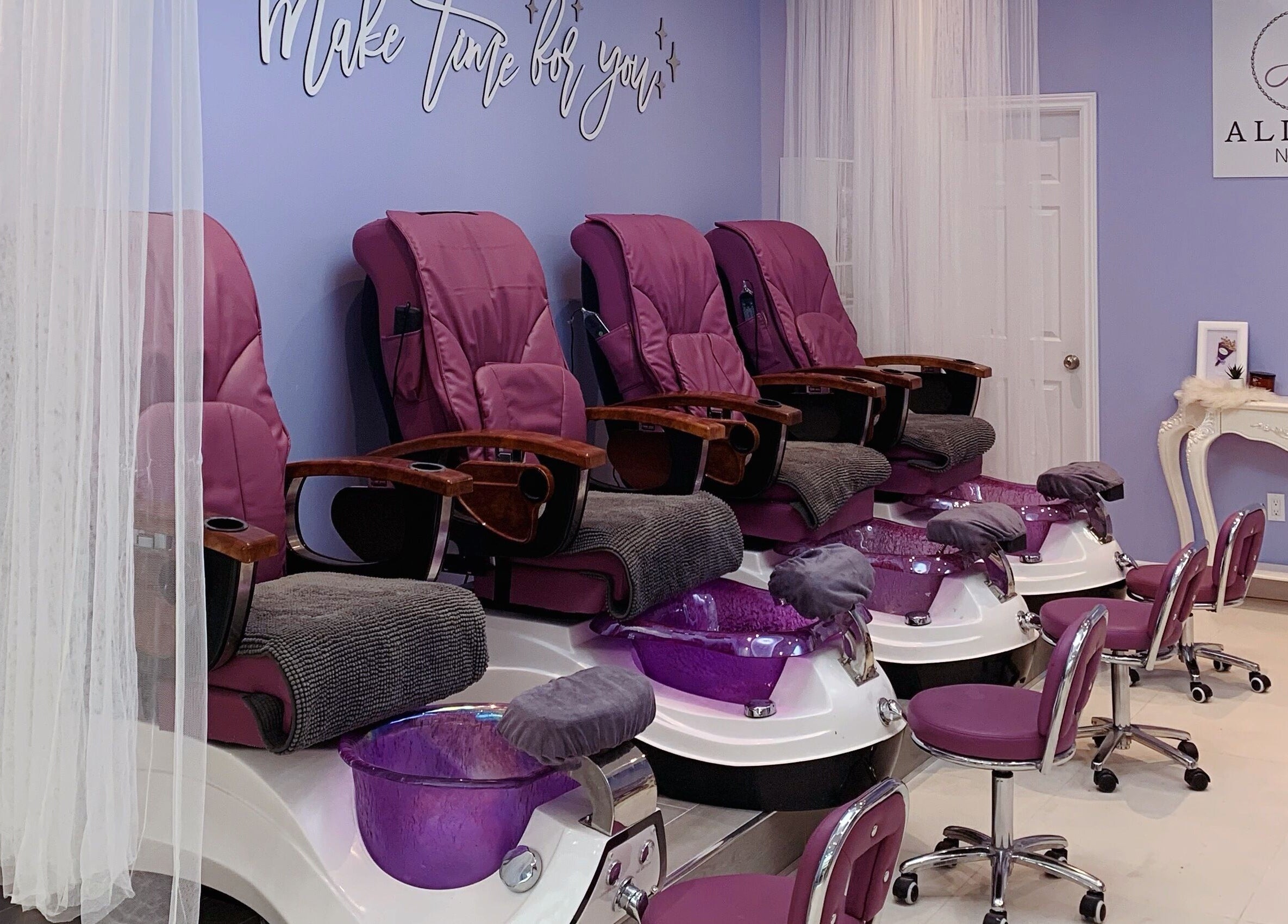 Luxurious pedicure chairs at Allure Nail Bar, Mississauga, Ontario, CA offer relaxation and style.