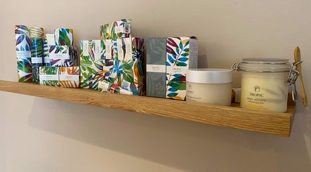 Gardenia Beauty Mobile Treatments in Blackpool, England offers vibrant Tropic products on wooden shelf.