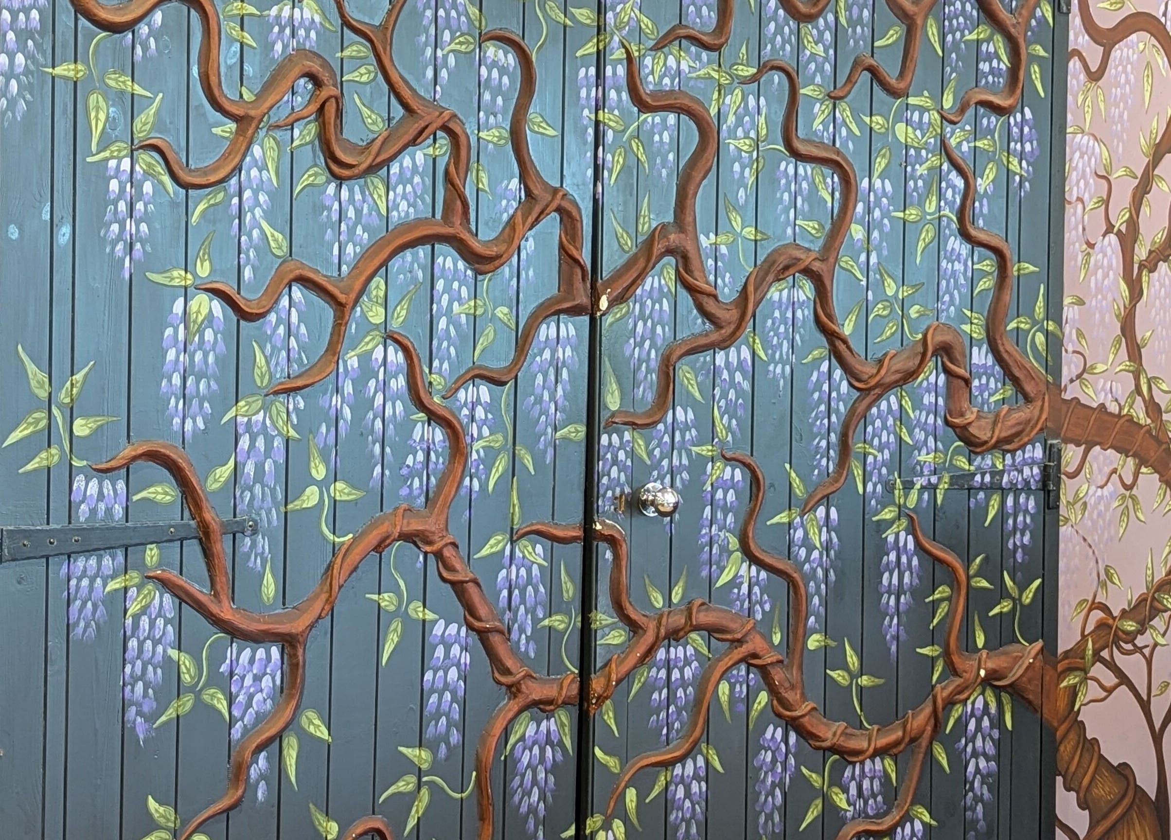 Beautiful floral mural on a wall at Gardenia Beauty at Lakeside, Hambleton, England, GB.